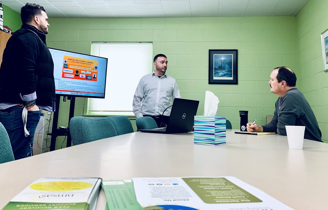 three team members in a meeting room